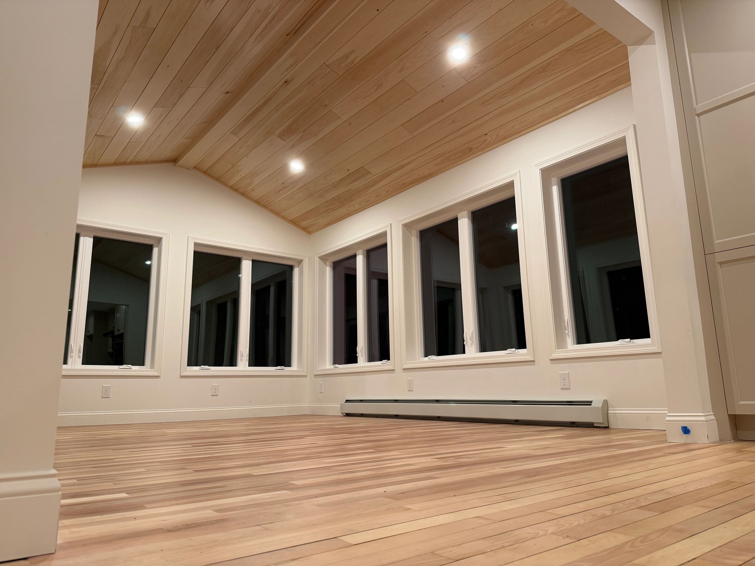 Modern interior with wood ceiling and large windows